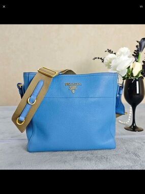 Prada Sky Blue Pebbled Leather Shoulder Bag with Tan Strap